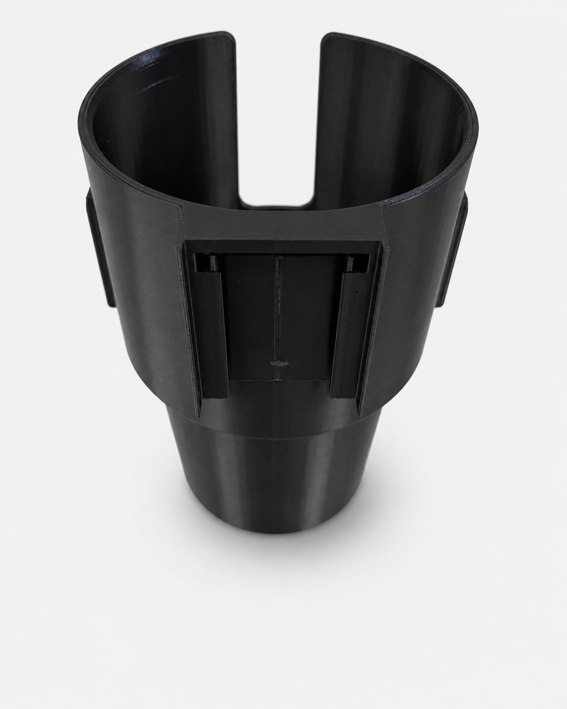 Alt text
Rear view of black RepRail universal boat cup holder showing quick-change mounting interface