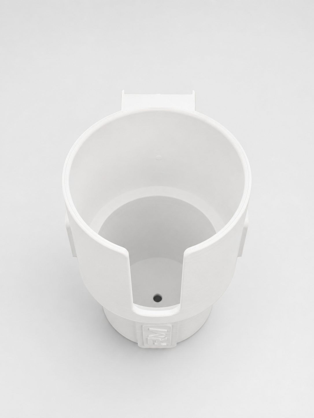 Top view of white RepRail universal boat cup holder showing open-front design and integrated drain