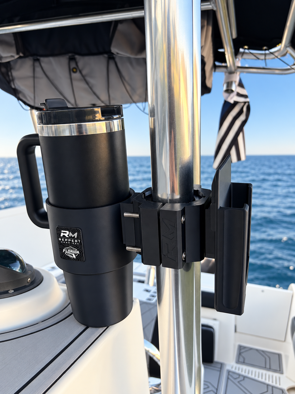 Black RepRail Dual Helm Kit with RM1 Dual clamp, cupholder and phone holder installed on stainless T-top tubing