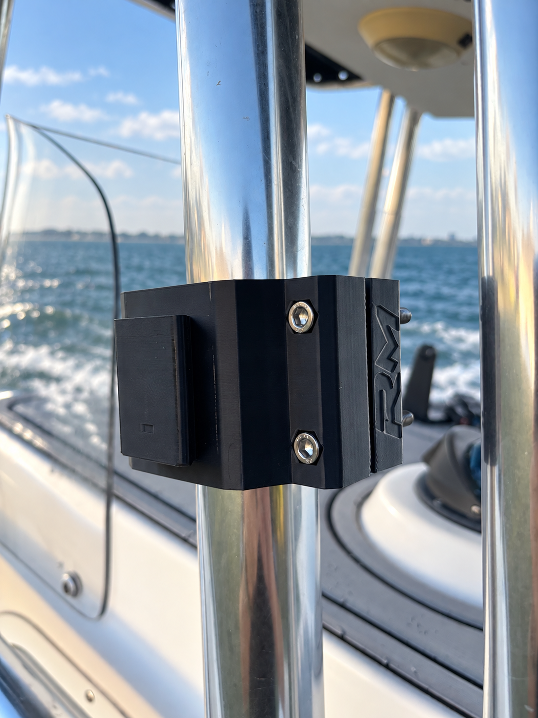 Black RepRail RM1 Dual boat rail clamp mounted on stainless T-top tubing, side view